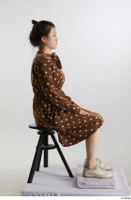    Aera  1 brown dots dress casual dressed sitting white oxford shoes whole body 0005.jpg